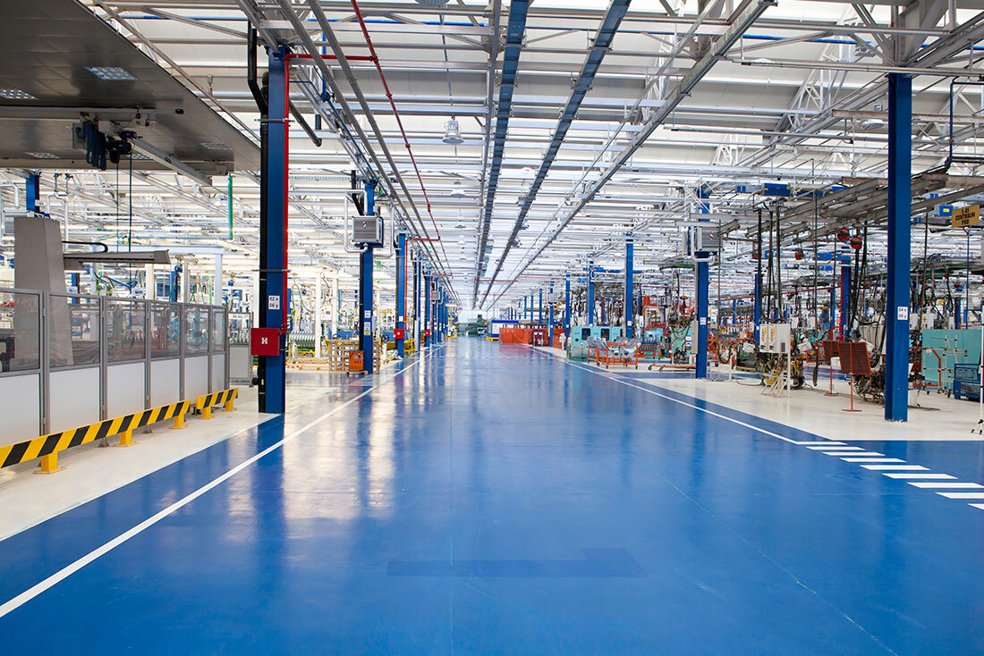Industrial epoxy floor coating in a factory